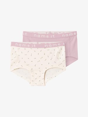 Deux paires de sous-vêtements pour enfants : l'une avec une base beige clair et un motif floral, l'autre en violet clair uni, toutes deux avec des ceintures contrastées.