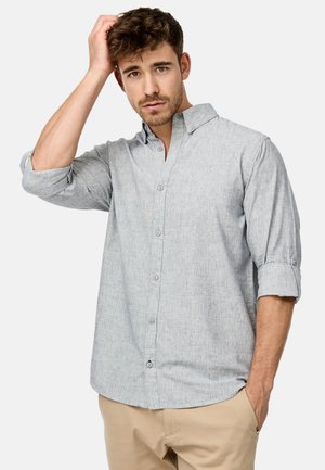 Gray, lightweight button-up shirt with a textured finish, rolled sleeves, and a collared neck; includes front buttons and a side slit.