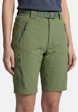 Person wearing olive green knee-length shorts with front and side zippered pockets and an olive green belt.