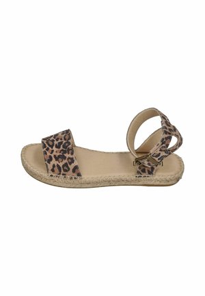Flat sandal with leopard print fabric straps, open toe, ankle buckle, and woven sole detail on a beige footbed.