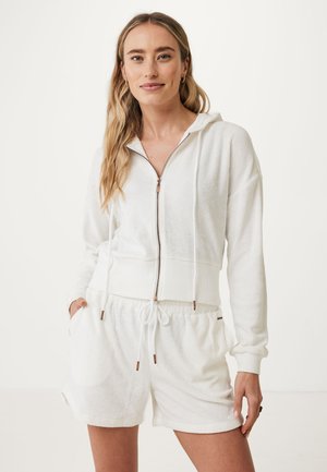 Witte zip-up hoodie van gestructureerde stof, met verstelbare trekkoord en geribbelde tailleband; gecombineerd met bijpassende shorts met zakken.