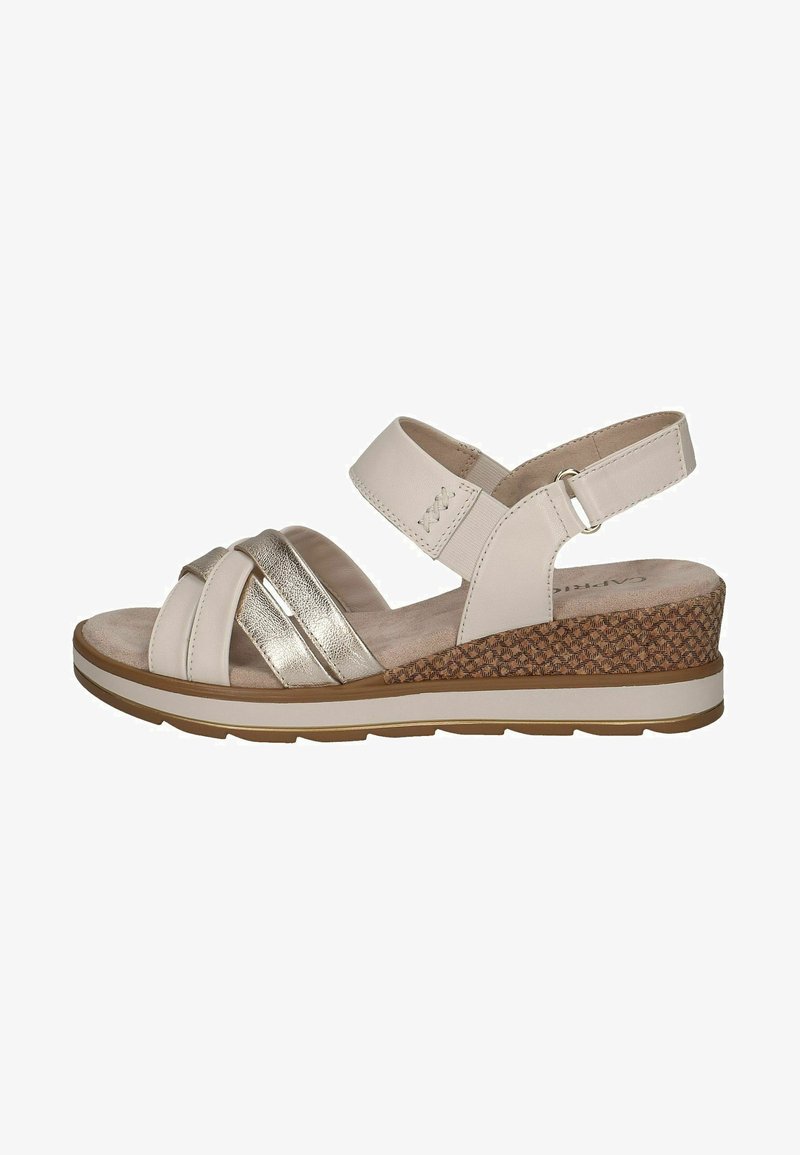 Svijetlosmeđi wedges sandali s metalnim naglascima, ukrštenim trakama i podesivom petnom trakom. Imaju teksturiranu pletenu petu i podstavljeni uložak.