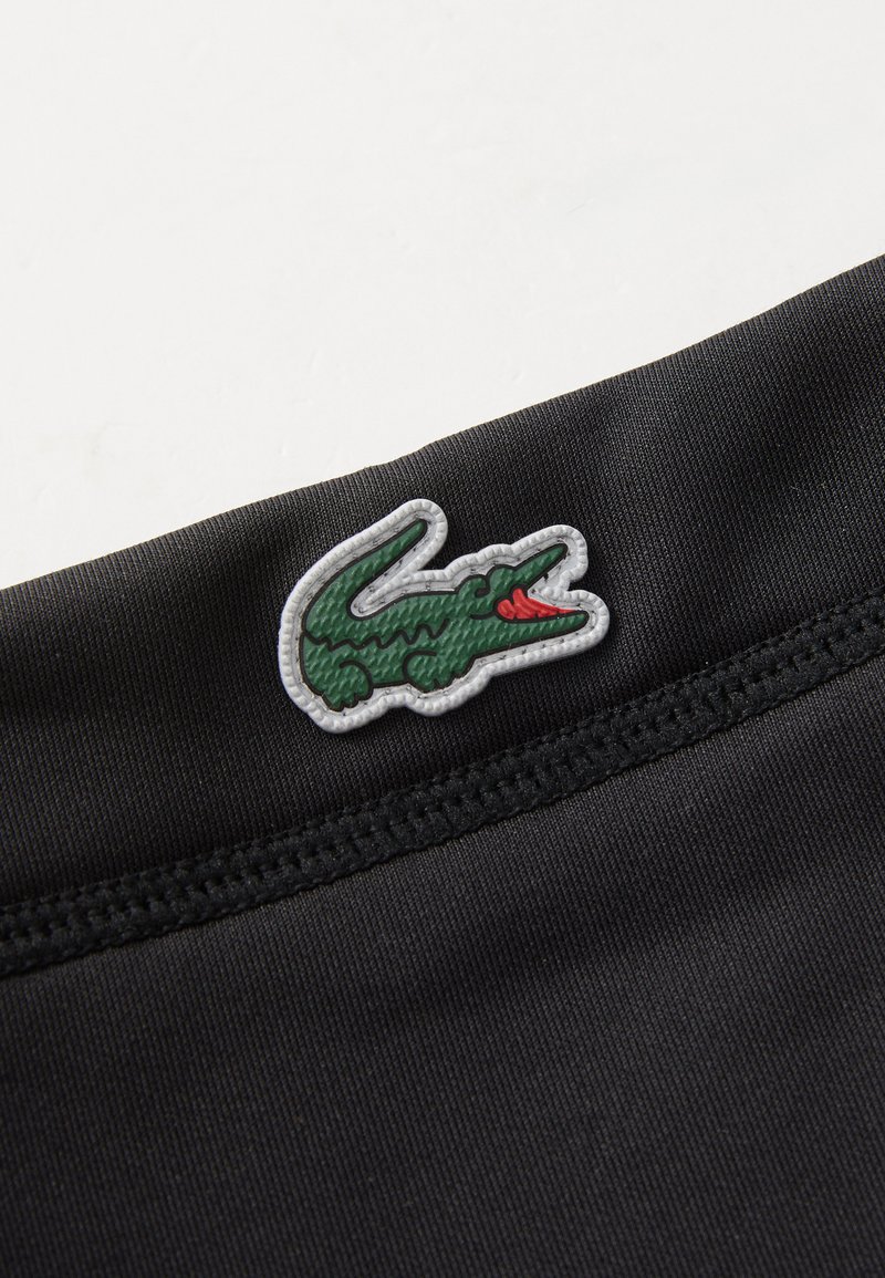 Lacoste Sport TUBE UNISEX - Mreža za lase - black