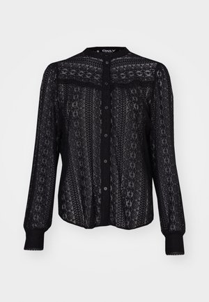 Chemisier noir à boutons, en dentelle transparente, présentant des motifs délicats, des manches longues avec des poignets élastiques et un col rond.