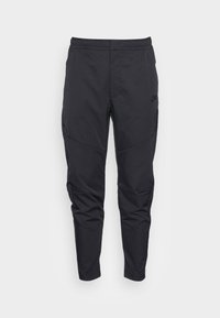 Black athletic pants made from lightweight, smooth fabric. Features an elastic waistband and tapered legs with seam detailing.