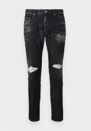 Black slim-fit jeans with faded areas and ripped details on both knees, front button closure, and five-pocket design.