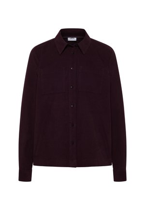 Dunkellila Cordshirt mit langen Ärmeln, Knopfleiste, spitzem Kragen und zwei Brusttaschen.