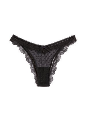 Schwarzer transparenter Spitzentanga mit Pünktchenmuster, gewellten Rändern und kleinem Schleifendetail in der vorderen Mitte.