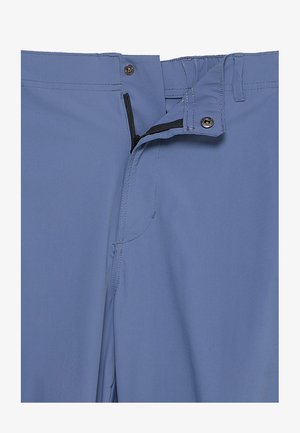 Jasnoniebieskie spodnie z zamkiem błyskawicznym, zapięciem na guzik i minimalistycznym przeszyciem. Wykonane z gładkiego, lekkiego materiału.