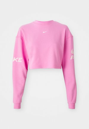 Sweatshirt court rose en mélange de coton, avec des manches longues. Logo Nike blanc sur la poitrine et texte le long de la manche gauche. Texture lisse.