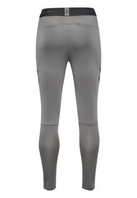 Leggings de sport gris avec une texture lisse, dotés d'une taille noire et de détails en mesh. Les jambes présentent des accents noirs contrastants.