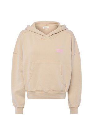 Beige cropped hoodie gemaakt van zacht materiaal, met een voorvak in kangoeroestijl en een roze "American Vintage" logo op de borst.