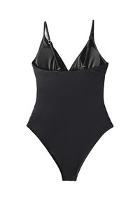 Costume intero nero con spalline sottili regolabili, scollo basso, tessuto liscio e aperture alte sulle gambe. Senza motivi o accessori.