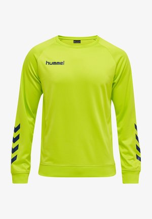 T-shirt de sport jaune-vert vif à manches longues avec logo noir hummel sur la poitrine et bandes chevrons noires sur les manches.