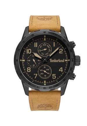 Montre analogique noire avec un bracelet en cuir brun texturé. Présente un cadran noir, des accents dorés, un tachymètre et trois sous-cadrans pour la date et l'heure.