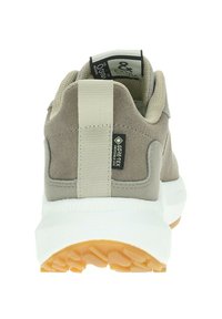 Sneakers GORE-TEX con tomaia marrone chiaro testurizzata, cinturino elastico e suola intermedia bianca. Presenta una suola in gomma per una migliore aderenza.