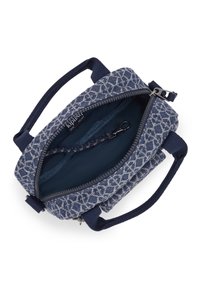 Blue patterned handbag with a zip closure, dual short handles, and a smooth interior lining. Features a small interior pocket with a clip.
