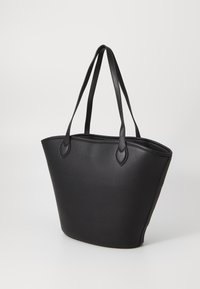 Black tote bag made of textured leather, featuring two sturdy handles and a wide, open design for easy access and storage.