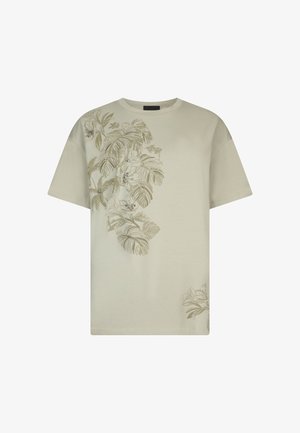 Beige short-sleeve t-shirt with botanical print featuring large leaves and flowers embellished with small rhinestones on front left side.