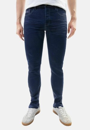 FEINE MIT DESIGN FALTEN UND KONTRASTNÄHTEN - Slim fit jeans - dunkelblau
