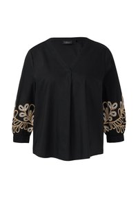Zwarte blouse met een V-hals en lange mouwen, voorzien van ingewikkelde gouden en zilveren blad-geborduurde details op de mouwen en elastische manchetten.