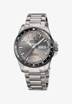 Titanium wristwatch with a silver-gray dial, black bezel, and stainless steel band. Features include quartz movement and a date display.