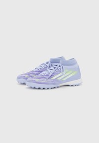 Light purple athletic shoes with a textured upper, featuring neon yellow stripes, a mid-top design, and a white rubber outsole.