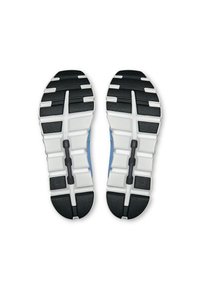 Semelles de chaussures de sport en noir et blanc avec des motifs texturés, présentant un design segmenté et des éléments de rembourrage pour le soutien.