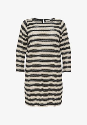 Põlve pikkune kleit ümmarguse kaeluse ja pikkade varrukatega, millel on musta ja kreemika vahelduv mustri zigzag, valmistatud tekstuuriga kudumiskangast.