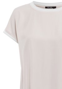 Light pink short-sleeve top made of soft fabric, featuring a contrasting white crew neckline and sleeve cuffs. Simple, modern design.