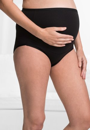 Schwarze Umstandsunterwäsche mit hohem Bund, dehnbarem Material, glatter Textur und breitem Bund, der einen wachsenden Bauch accommodates.