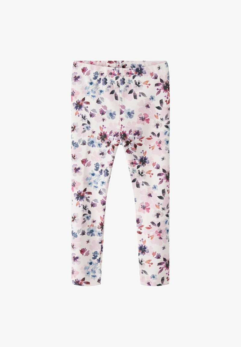 Bloemenleggings van lichtgewicht stof, met een pastelroze achtergrond en verspreide paarse en blauwe bloemen en groene bladeren.