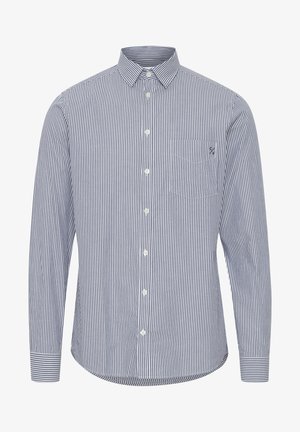 Langermet skjorte med knapper i navy og hvite vertikale striper, spredt krage, frontlomme og avrundet hem. Tilpasset passform.