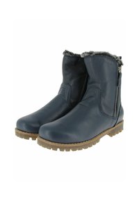 Bottines en cuir bleu marine avec doublure en fourrure, fermetures éclair sur le côté et semelles en caoutchouc épais marron avec des crampons profonds pour un usage hivernal.