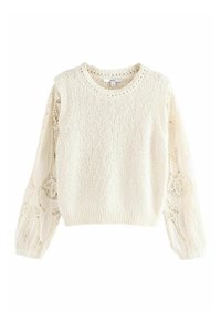 Kremowy sweter z teksturowanym dzianinowym korpusem i przezroczystymi balonowymi rękawami z koronką, zdobionymi kwiatowym wzorem. Okrągły dekolt i ribbowe wykończenie u dołu.