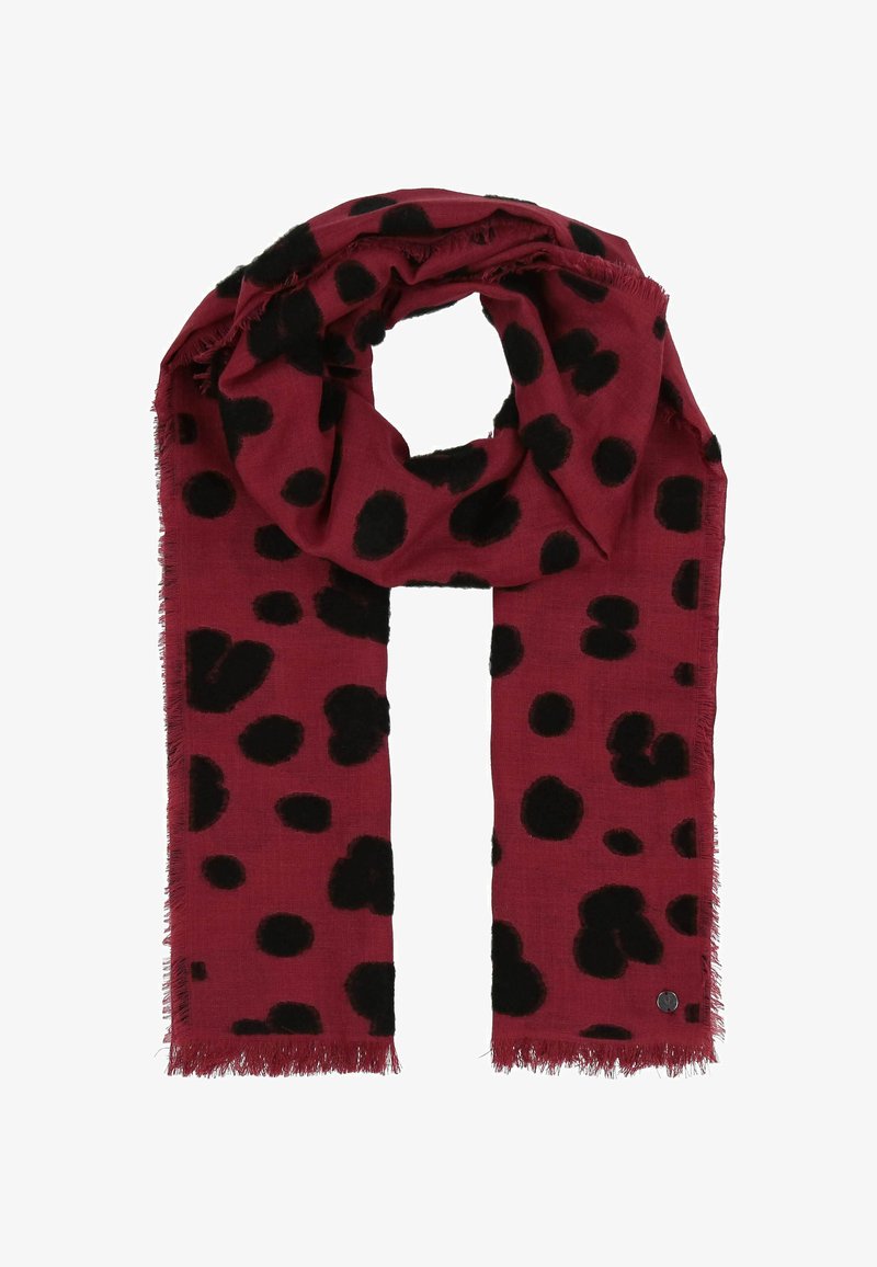 Écharpe rouge avec de grands pois noirs, bords effilochés, en matériau doux, conçue pour la chaleur et le style.