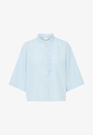 Camicia azzurro chiaro con maniche corte, caratterizzata da strisce bianche verticali e un volant lungo il chiusura dei bottoni. Materiale in cotone.