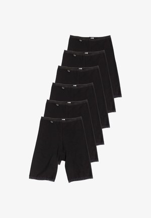 Sei paia di pantaloncini da biker neri da donna con bordatura in pizzo impilati diagonalmente su uno sfondo bianco.