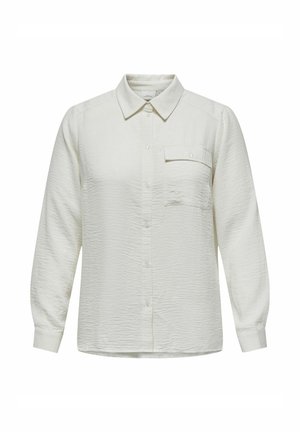 Fehér, texturált, galléros, hosszú ujjú ing. Egyetlen mellzsebével és elől gombos záródással rendelkezik.