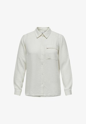 Fehér, texturált, galléros, hosszú ujjú ing. Egyetlen mellzsebével és elől gombos záródással rendelkezik.