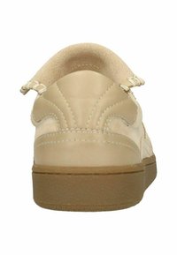 Beige sneaker with a smooth leather upper, suede accents, and a textured rubber sole. Features stitched detailing and a rounded back.