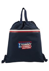 Bolsa de drawstring azul marino con el logo de Tommy Hilfiger en rojo, blanco y azul y una franja horizontal en rojo, blanco y azul cerca de la parte superior.