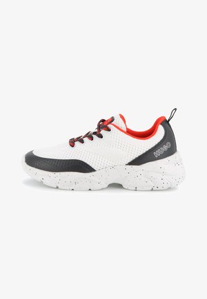 White mesh sneaker with red accents, black detailing on the toe and heel, and a speckled white sole. Features black laces and branding.