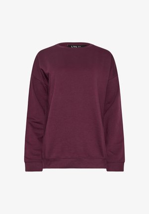 Burgundowa bluza z okrągłym dekoltem, wykonana z miękkiego materiału, z długimi rękawami, ściągaczami przy mankietach i na dole, o luźnym kroju. Bez wzorów ani grafik.
