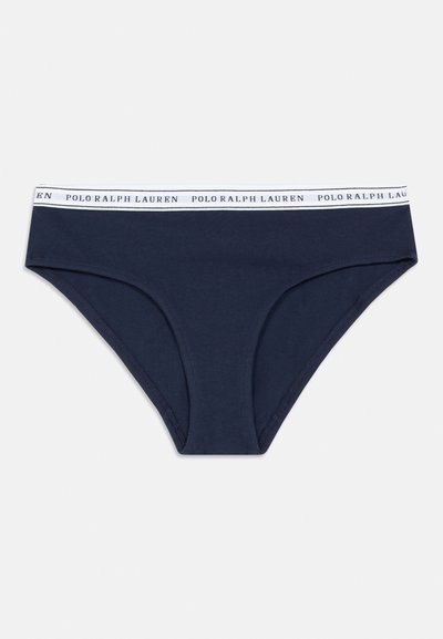 Ναυτικό μπλε βαμβακερά μπικίνι σλιπ με λευκή ελαστική ζώνη που φέρει τυπωμένο το κείμενο "POLO RALPH LAUREN" γύρω της. Λείο υλικό.