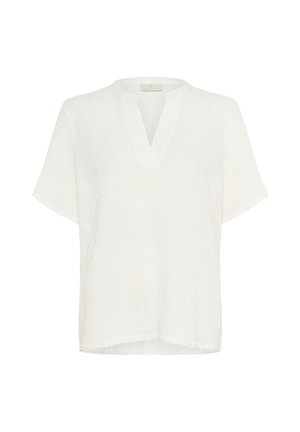 Blouse blanche texturée à manches courtes avec col en V et ourlet droit, présentée sur un fond blanc uni.