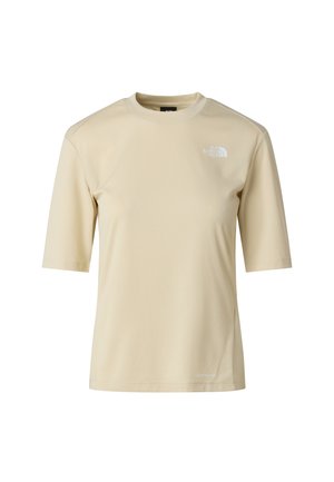 Krátký rukáv, béžová košile z texturované látky s malým bílým logem na levé horní straně a rovnou spodní hranou v oblasti pasu.