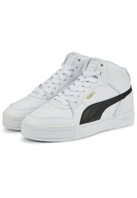 Valged kõrge säärega tossud tekstureeritud nahkpealsega, mustade aktsentidega, pehmendatud krae ja silmapaistva logoga küljel.