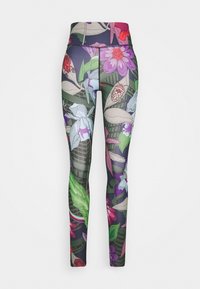 Leggings taille haute avec un motif botanique coloré de grandes fleurs, de feuilles et de formes abstraites sur un fond sombre.
