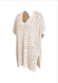 Poncho de punto color crema con cuello en V, patrones geométricos calados y aberturas laterales para un ajuste holgado.